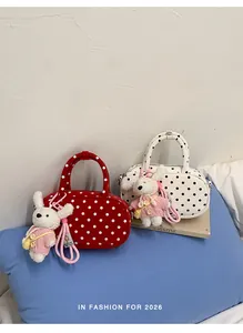 Korean style polka dot shoulder bag sweet handbag with cute knitted rabbit plush keychain.