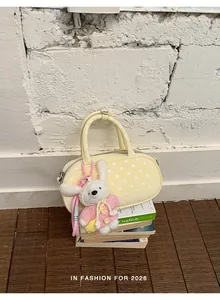 Yellow polka dot bowling handbag with cute bunny plush pendant sweet chic shoulder bag.