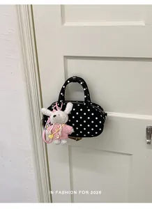 Korean style polka dot bowling shoulder bag with cute plush rabbit pendant, trendy chic.