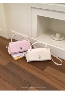 Elegante minimalistische kleine quadratische Handtaschen in Rosa und Creme mit Knoten-Griff