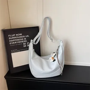 Light blue slouchy shoulder bag minimalist hobo crossbody bag with cute puppy pendant