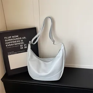 Light blue soft leather shoulder underarm bag, versatile crossbody dumpling bag for women.