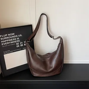 Brown PU leather shoulder hobo bag, stylish crescent dumpling crossbody bag for women.