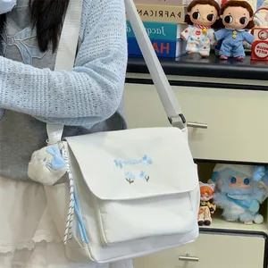 White canvas crossbody messenger bag for women, large capacity daily commuting shoulder bag.