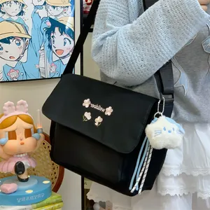 Stylish large capacity canvas crossbody bag for women, commuter messenger bag with floral design.