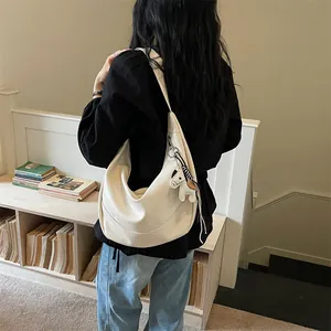 Women white shoulder dumpling bag casual hobo crossbody bag with cute horse charm spring.