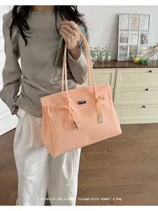 Detail view of the elegant jelly tote bag showcasing large capacity and smooth texture.