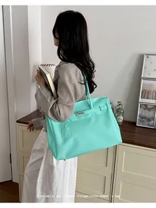 Mint green large capacity tote bag for women, stylish vintage shoulder handbag.
