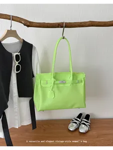 Detailed view of neon green jelly tote bag, stylish shoulder handbag for women and commute.