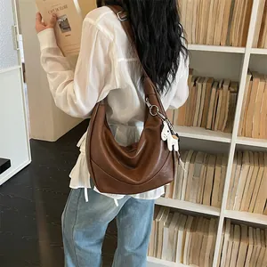 Stylish brown slouchy hobo shoulder bag for women, premium soft PU leather crossbody handbag.