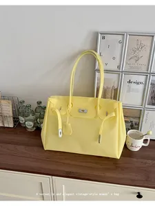 Yellow jelly tote bag for women, large capacity shoulder handbag for daily commute.