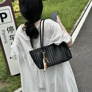Black woven leather shoulder tote bag for women, large capacity stylish casual handbag.