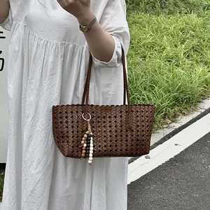 Stylish brown woven tote bag for women, large capacity hollow design casual shoulder bag.