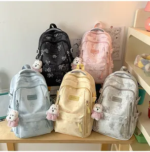 Collection of cute bear print backpacks for girls in five pastel colors with charms
