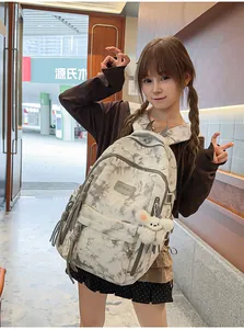 Fashionable tie-dye multilayer schoolbag for students shown in a lifestyle model shot