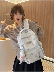 Cute bear print large capacity student backpack worn by a girl in a casual setting