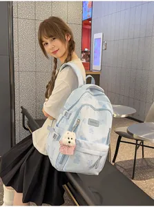 Cute bear print backpack for girls with a plush puppy keychain attachment