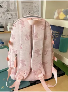Back view of pink student schoolbag with cute bear prints and adjustable straps