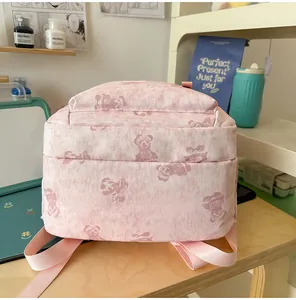 Close-up detail of the lovely bear print pattern on this cute pink student backpack.