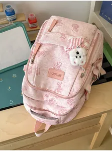 Cute pink school backpack for women students, sweet bear print bookbag with plush pendant.