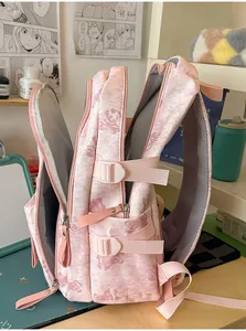 Detailed side view of large capacity pink backpack with cute bear print