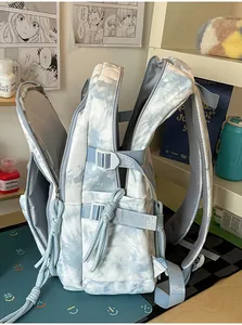 Detailed side view of large multi-compartment tie-dye student backpack storage space