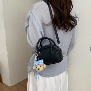 Minimalist black Boston crossbody bag with cute teddy bear pendant for women daily wear