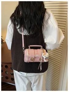Pink plaid crossbody Boston bag with lace trim, metal lock and cute character pendant.