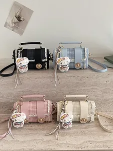 Stylish contrast color Boston handbag, cute cartoon pendant commuter shoulder bag for women
