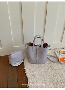 Minimalist leather bucket bag with pouch, stylish casual shoulder bag for women daily use.