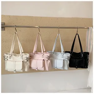 Four versatile tote bags in pastel colors hanging on a minimalist display rod.