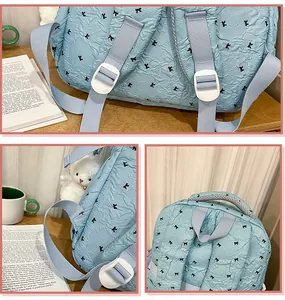 Casual light blue school backpack with cute bow pattern, perfect for daily travel and student use.