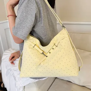 Stylish yellow polka dot tote bag for women, large capacity casual shoulder bag for daily commute.