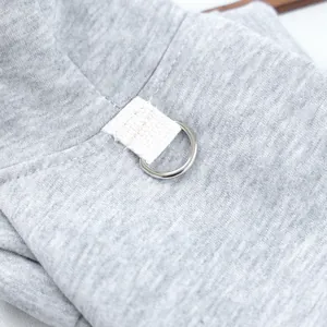Grey pet hoodie detail shot, soft comfortable fabric featuring metal D-ring attachment.