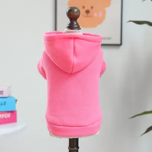 Detailed shot of a cute pink pet hoodie for small dogs, soft knitted fabric with hood.