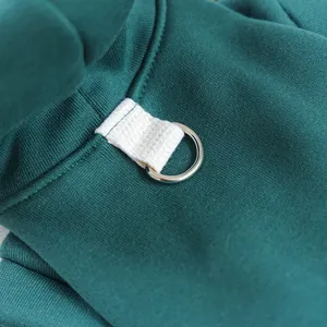 Pet hoodie clothing detail view showcasing durable fabric and metal D-ring attachment.