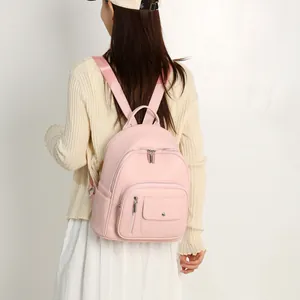 Elegante zaino da donna rosa per viaggi e studio quotidiano con pratiche tasche.