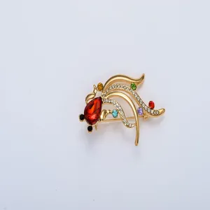 Exquisite gold goldfish brooch featuring sparkling red and multi-colored crystal rhinestones.