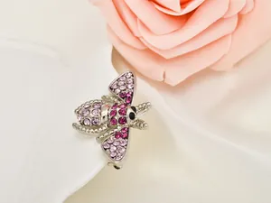 Exquisite crystal rhinestone bee brooch pin, elegant silver alloy insect jewelry detail.