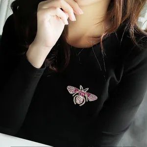 Elegant rhinestone bee brooch for women, sparkling crystal insect pin for apparel, fashion alloy jewelry.