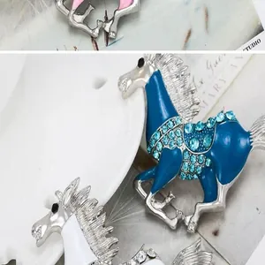 Fashion zinc alloy horse brooch pins with enamel drip oil and sparkling rhinestones.