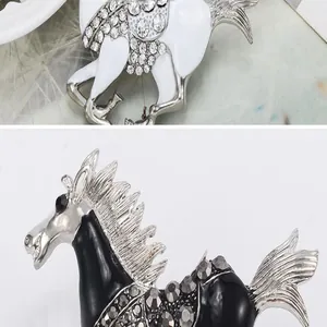Detail shot of exquisite running horse brooch with enamel and sparkling rhinestones.