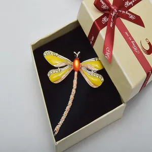 Exquisite dragonfly brooch featuring colorful enamel and rhinestone details in gift box.