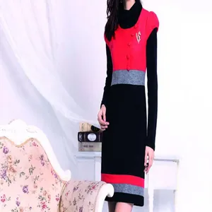 Women color-block long sleeve turtleneck knit dress with stylish brooch and elegant design.