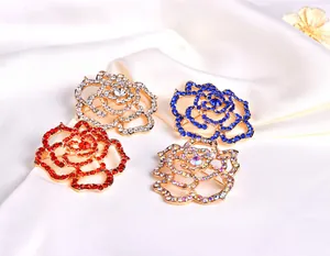 Detailed close-up of exquisite alloy rhinestone rose brooches in multiple sparkling colors.