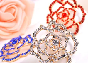 Crystal rhinestone rose flower brooch pin close-up detail, elegant alloy fashion jewelry.