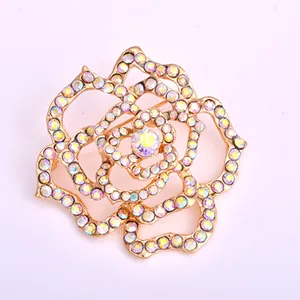 Elegant gold-tone crystal flower brooch, sparkling rhinestone camellia pin for women outfits.