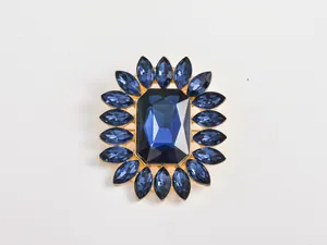Exquisite blue crystal flower brooch detail, sparkling rhinestone design for elegant outfits.