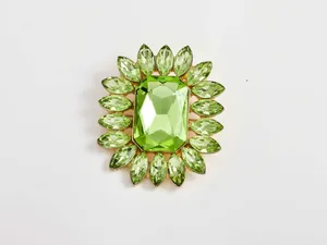 Exquisite green crystal rhinestone flower brooch, elegant jewelry detail accessory for women.
