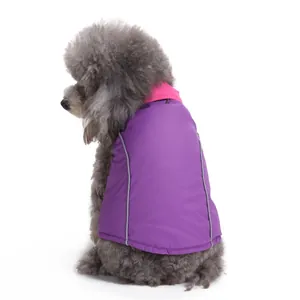 Back view detail of purple dog winter vest with reflective strips on grey poodle